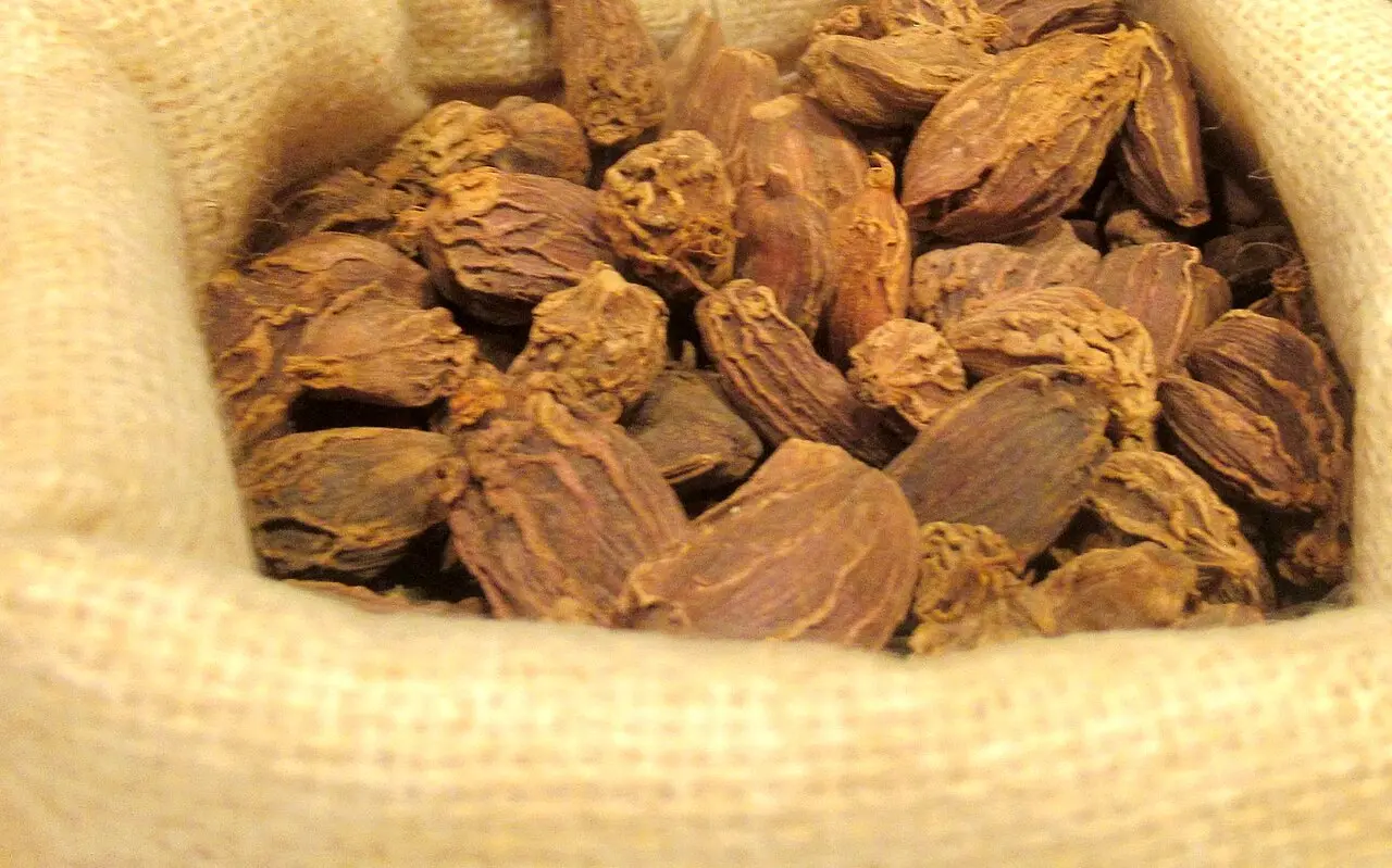 sack filled with dried large black cardamom pods