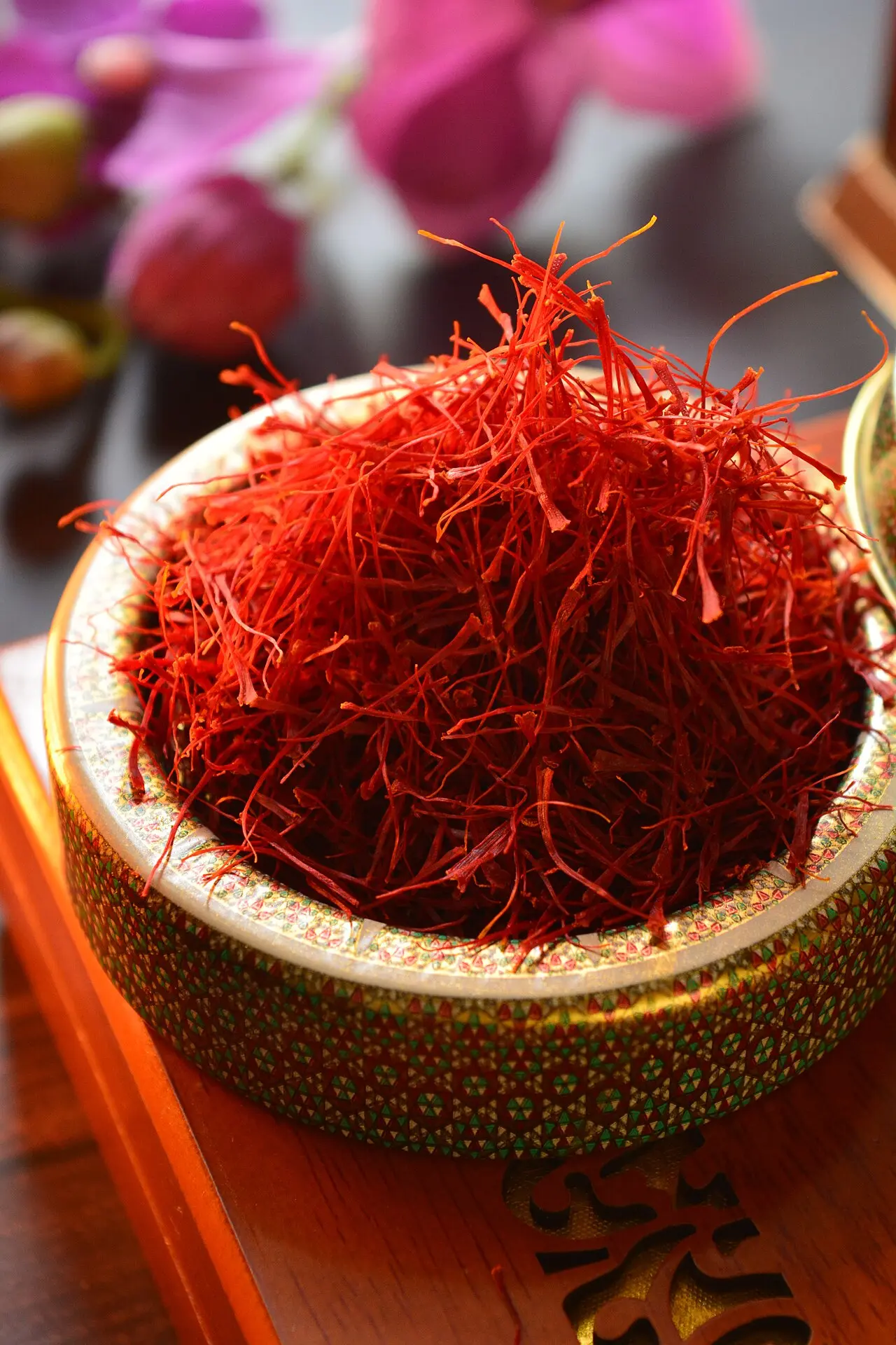 Decorative bowl heaped with bright saffron threads